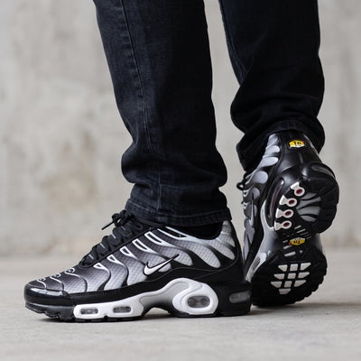 Nike Air Max Plus Tuned black gradient sneakers with visible Tuned Air pods