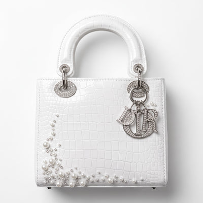 White croc-embossed Dior Lady tote with pearl embellishments and Dior letter charms
