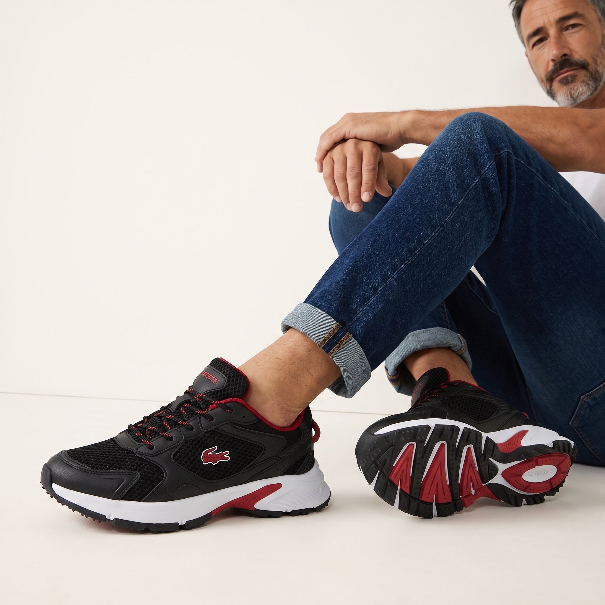 Black and red Lacoste chunky trainers with white midsole and crocodile logo