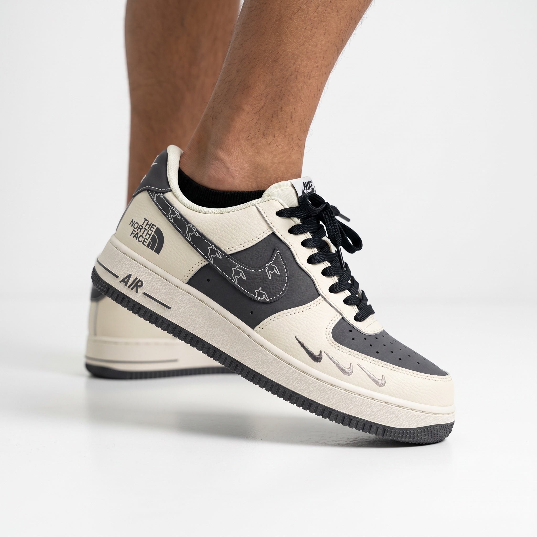 Nike Air Force 1 x The North Face cream and dark grey low-top sneaker