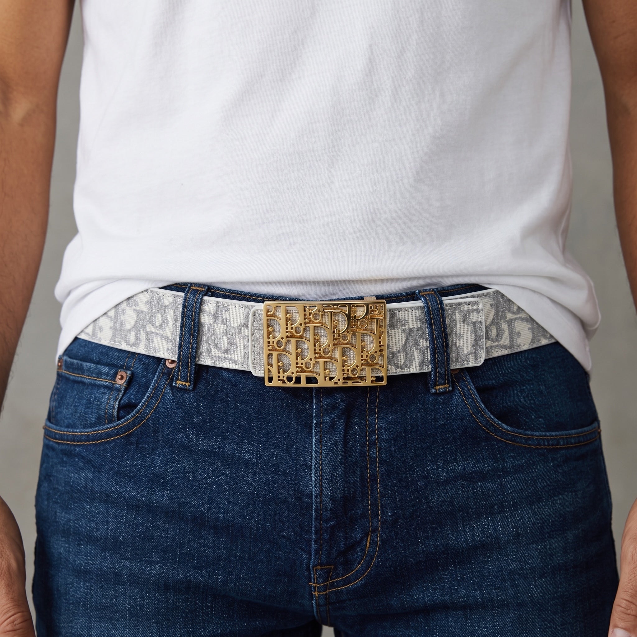 Dior monogram belt with gold buckle worn with jeans