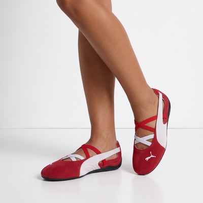 Red and white Puma ballet flats with criss-cross straps