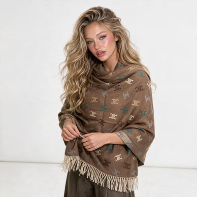 Brown Celine Triomphe shawl with fringe and repeating logo motif wrapped around model
