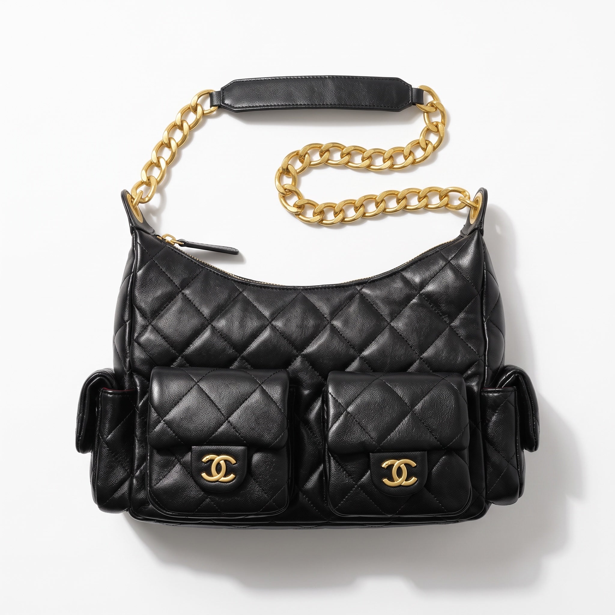 Black quilted Chanel shoulder bag with gold chain and multiple flap pockets