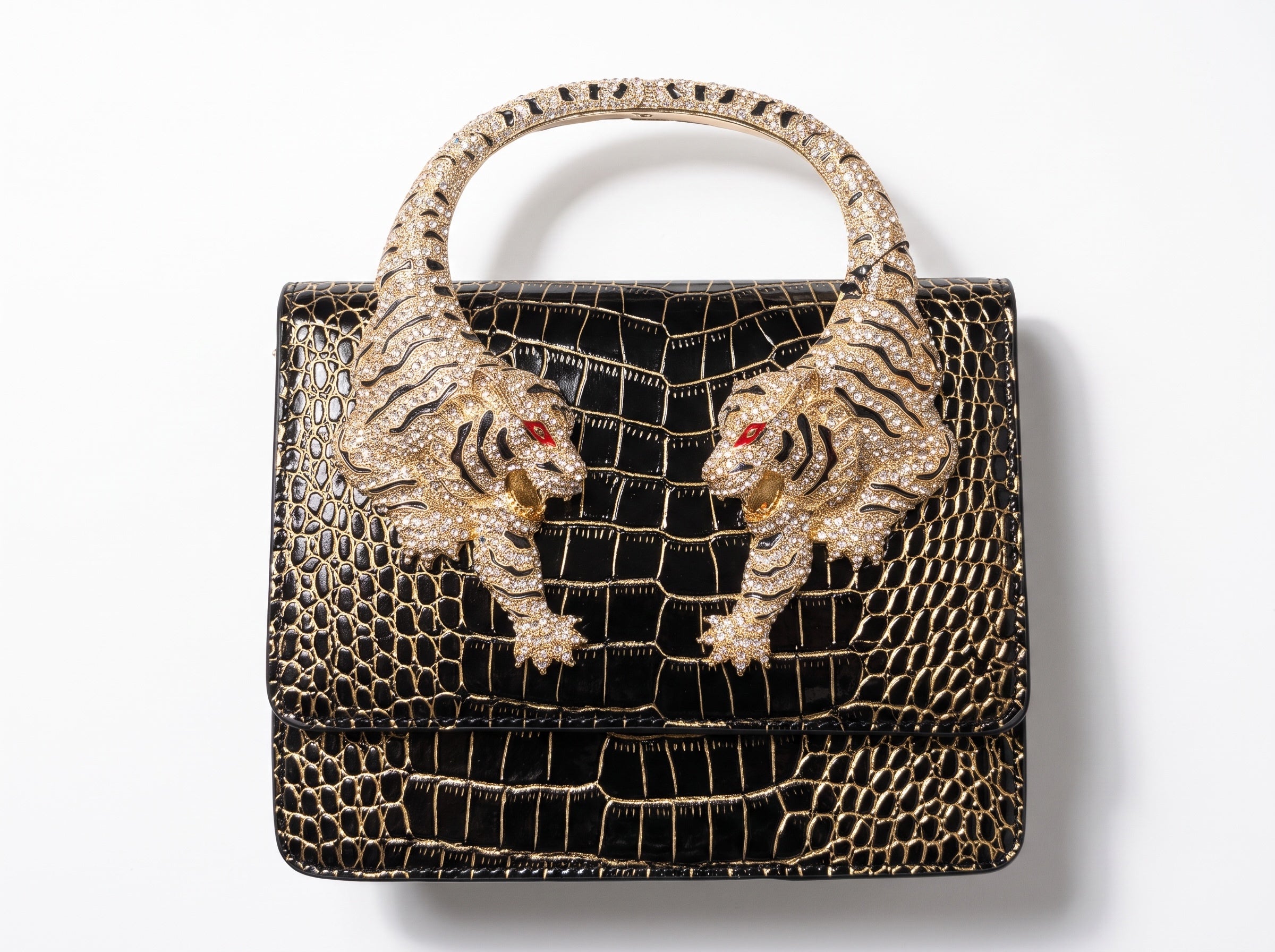 black croc-effect top-handle bag with gold tiger-head circular handle and crystal detail
