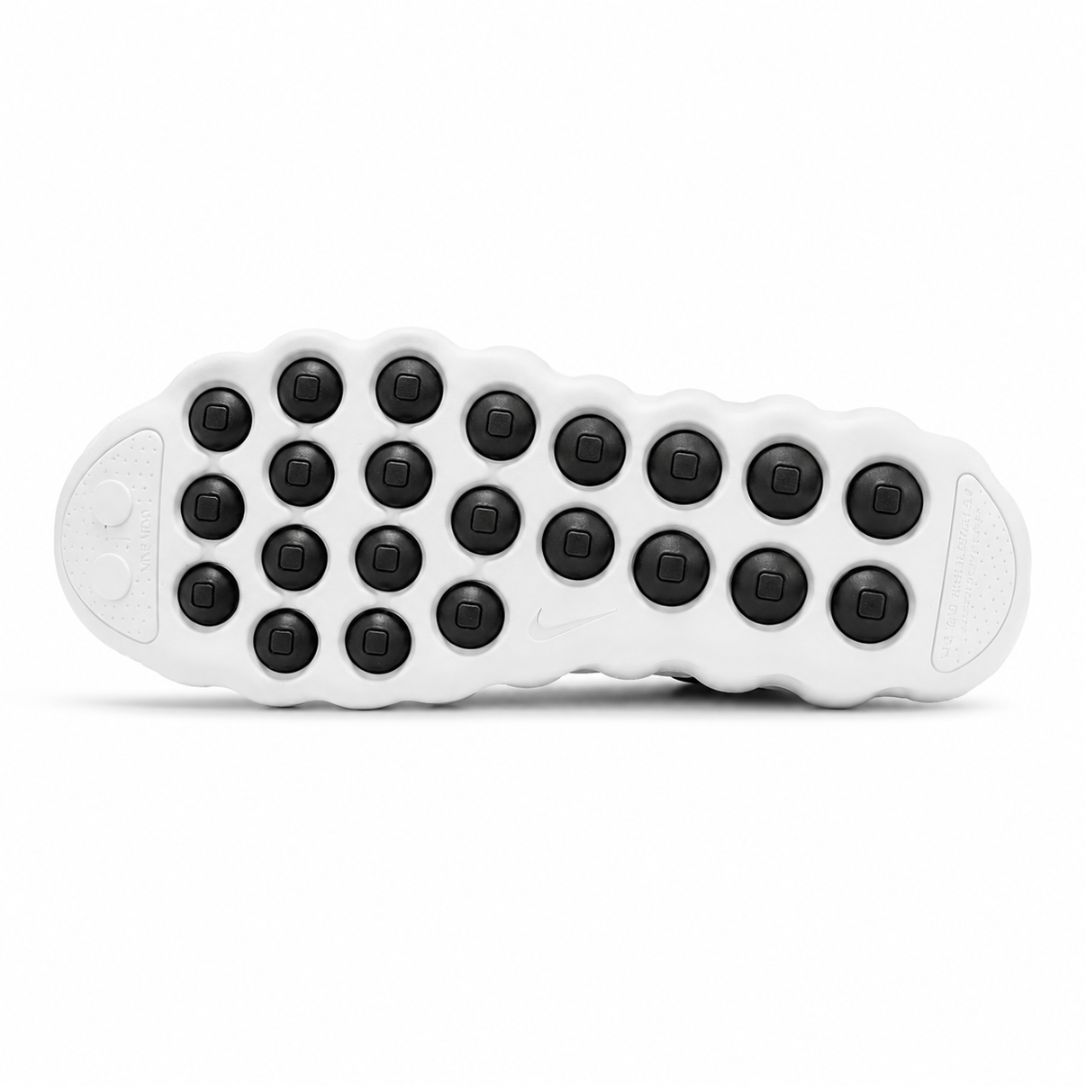 White Nike low-top perforated sneaker with black heel and podded sole