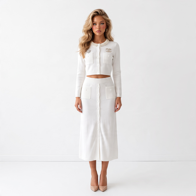 Cream cropped cardigan with pearl collar, chest pockets and decorative brooches