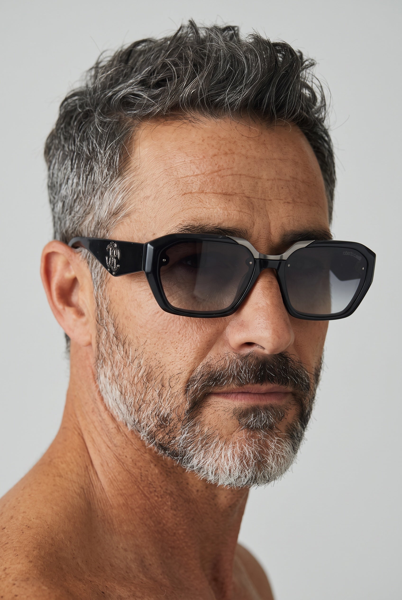 Roberto Cavalli black geometric sunglasses with gradient lenses and logo detail on temple