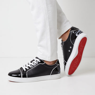 Christian Louboutin black low-top sneakers with red soles and white piping