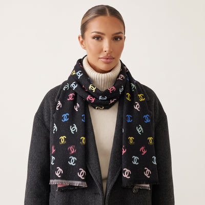 Black scarf with multicolor Chanel CC logo pattern and fringed ends