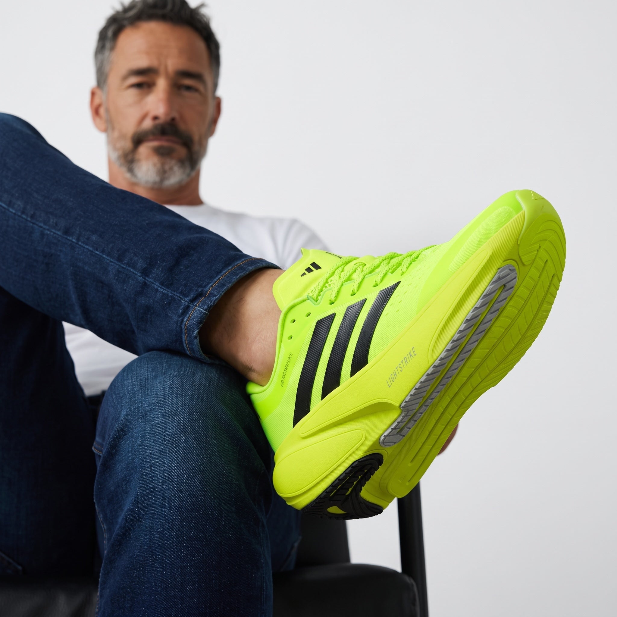 Adidas Adizero Supernova neon yellow running sneakers with black stripes