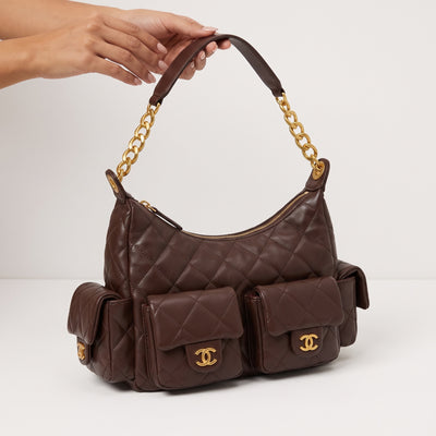 Chocolate brown quilted Chanel shoulder bag with gold chain and CC hardware