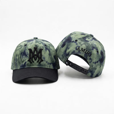 Green tie-dye Amiri baseball cap with black embroidered logo and black brim