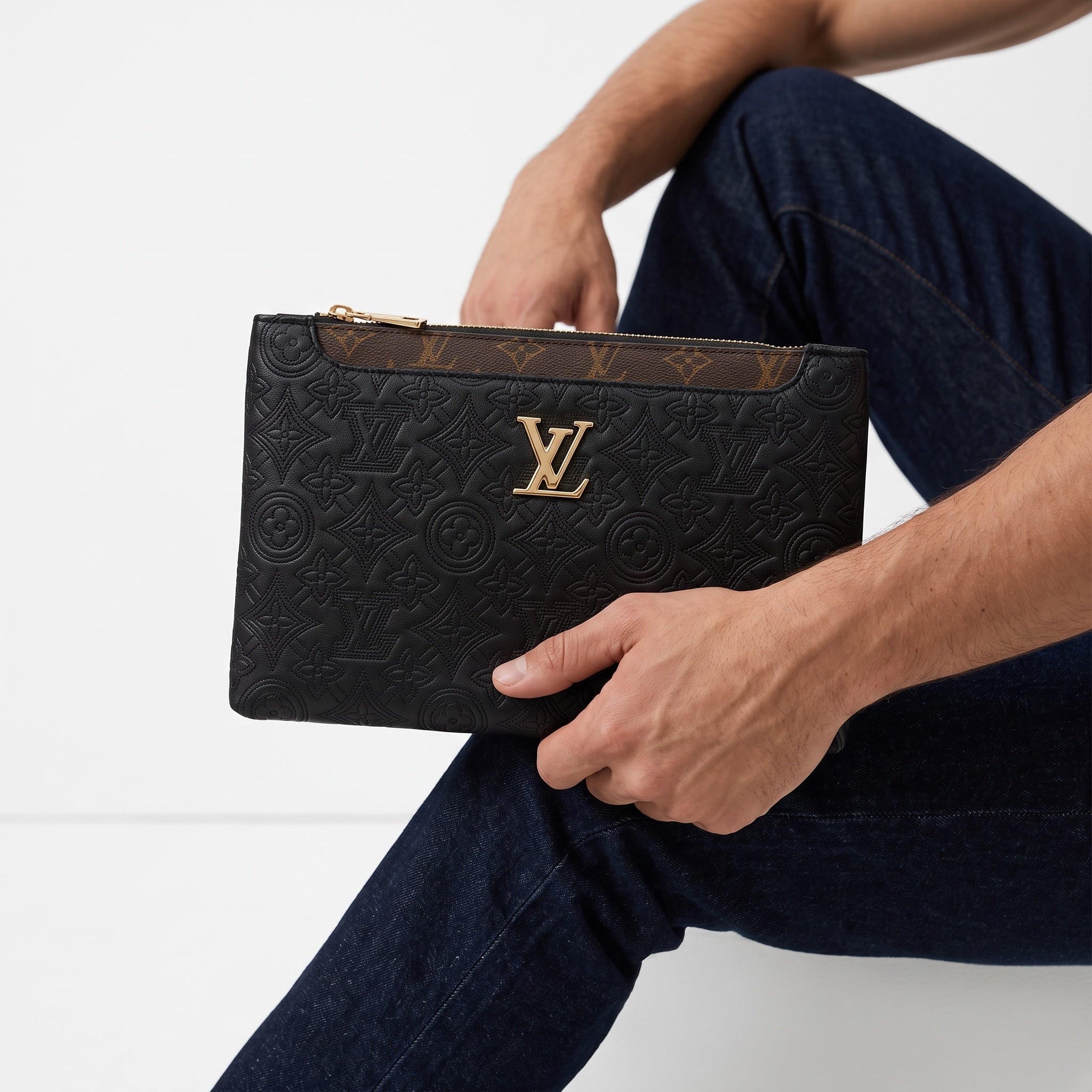 Black Louis Vuitton embossed monogram clutch pouch with gold LV logo and zipper