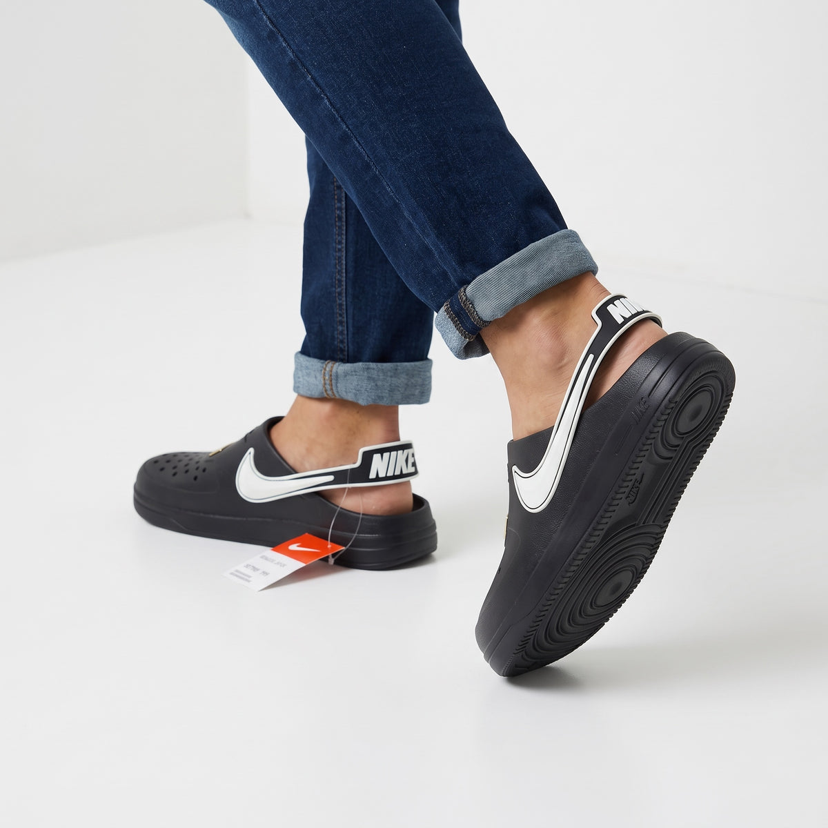 Black Nike AF1-style clog with white Swoosh and back sling strap