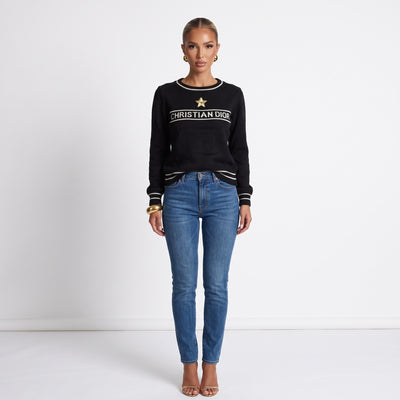 Black Christian Dior knit sweater with white trim and gold star applique
