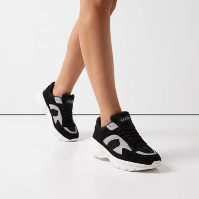 Celine black and white chunky sneakers on model