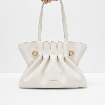 white Ferragamo pleated tote with gold logo hardware and double handles