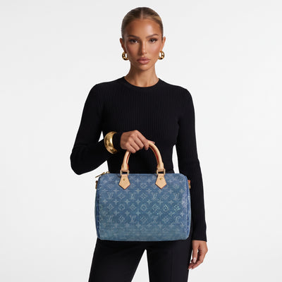 Blue Louis Vuitton monogram top-handle bag with crystal-like embellishment and beige handles