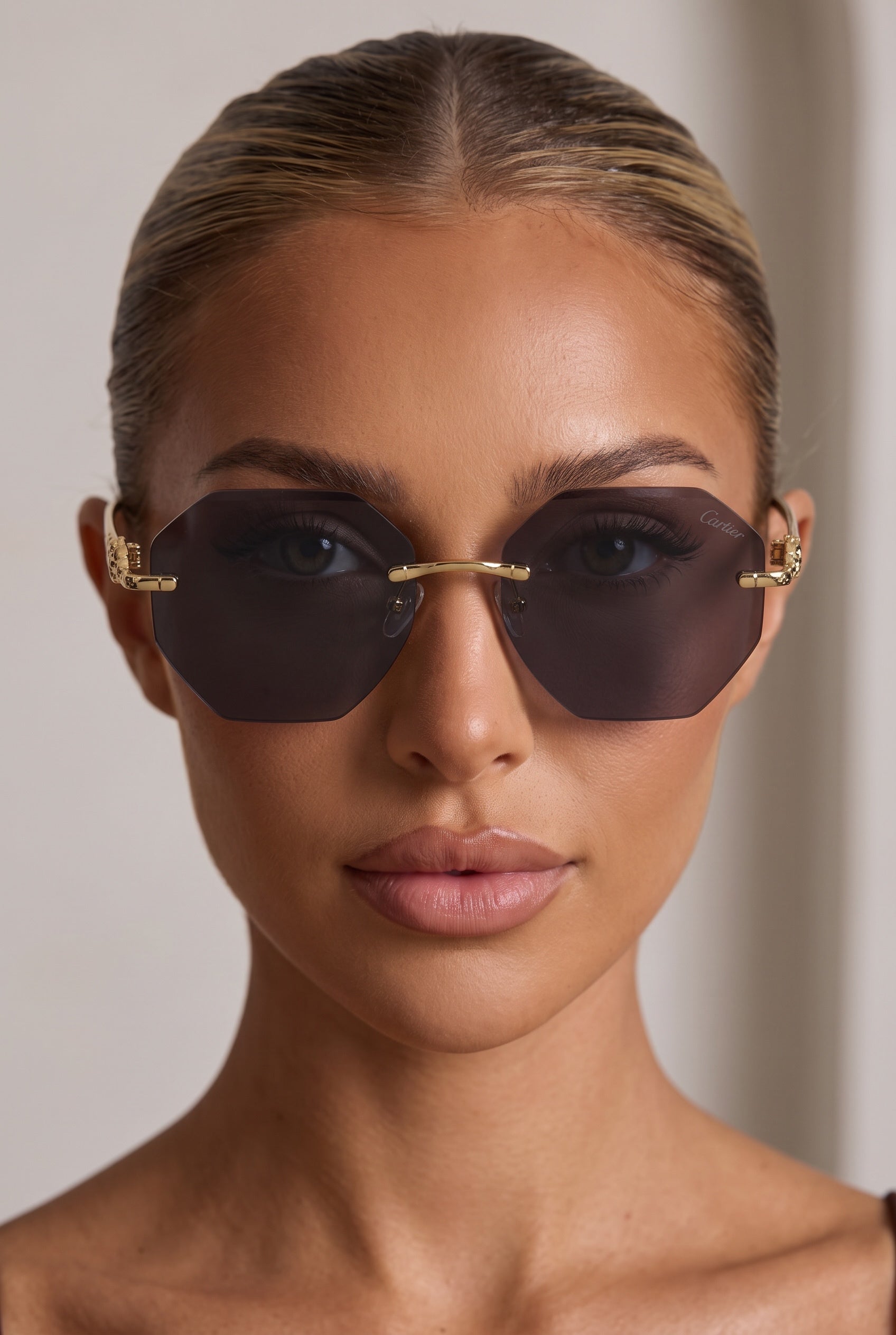 Cartier rimless octagon sunglasses with dark brown lenses and gold-tone panther temple details