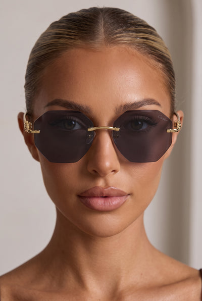 Cartier rimless octagon sunglasses with dark brown lenses and gold-tone panther temple details