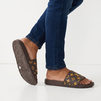 brown Louis Vuitton monogram slide sandal with embossed sole