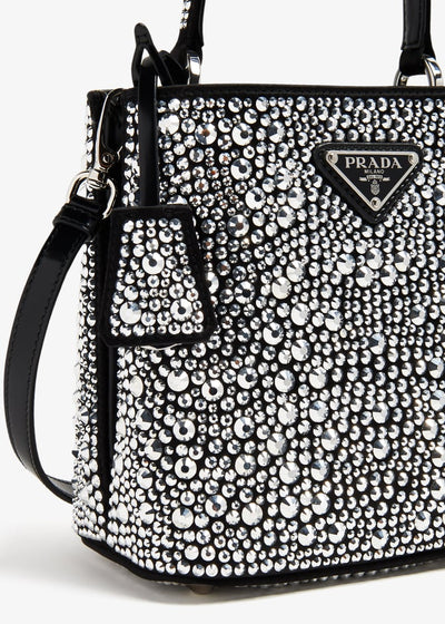 Prada black bucket bag covered in crystals with top handle and shoulder strap