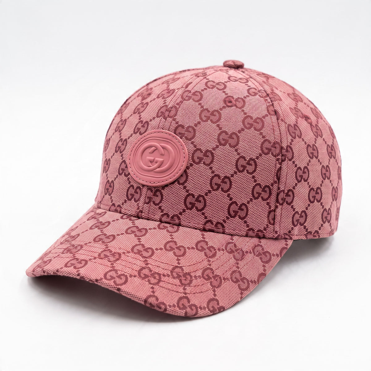 pink Gucci baseball cap with GG monogram and tonal rubber GG badge