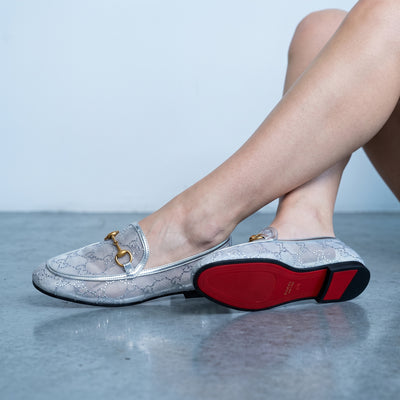 Silver Gucci mesh loafers with gold horsebit and red sole