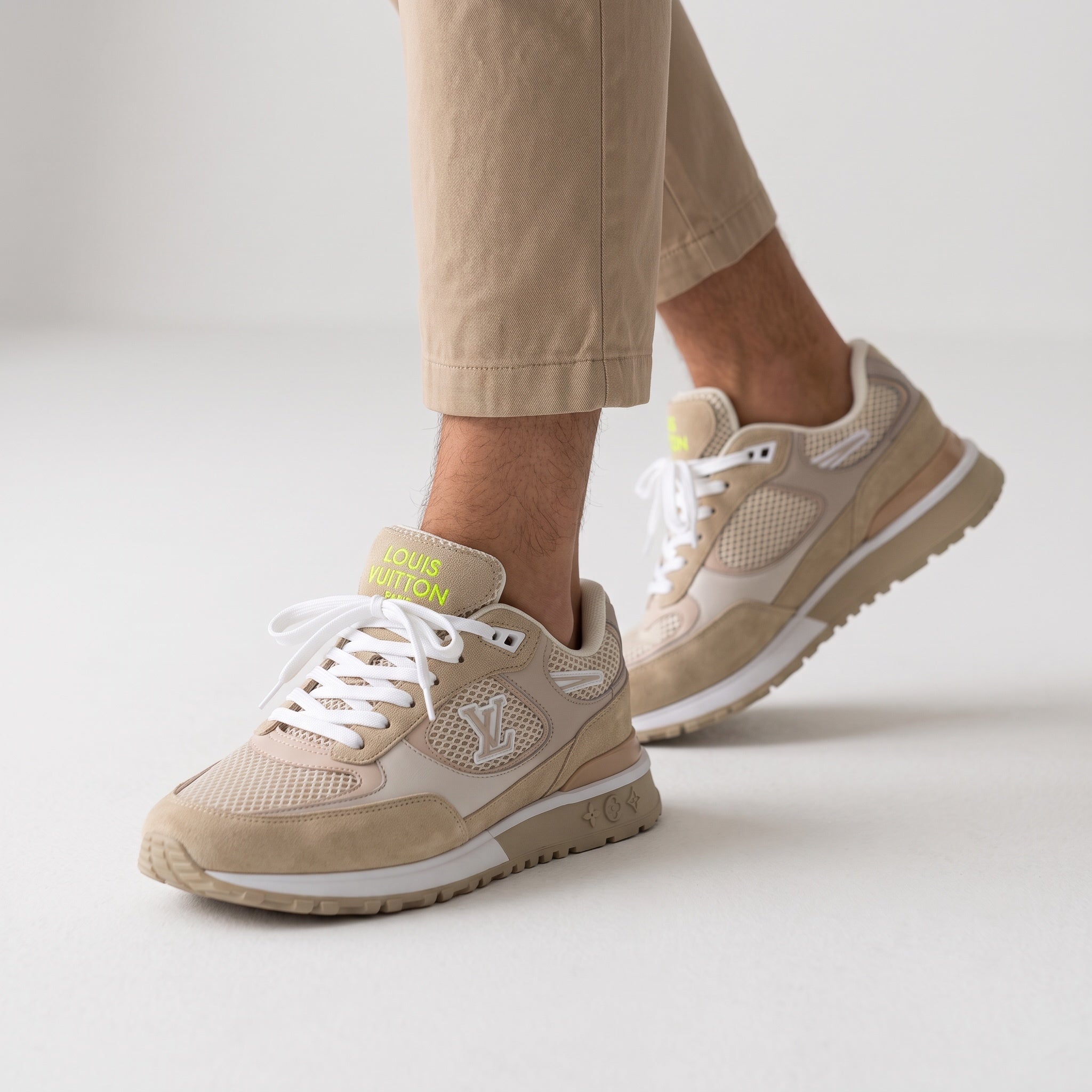 Beige Louis Vuitton low-top sneakers with LV logo and mesh panels