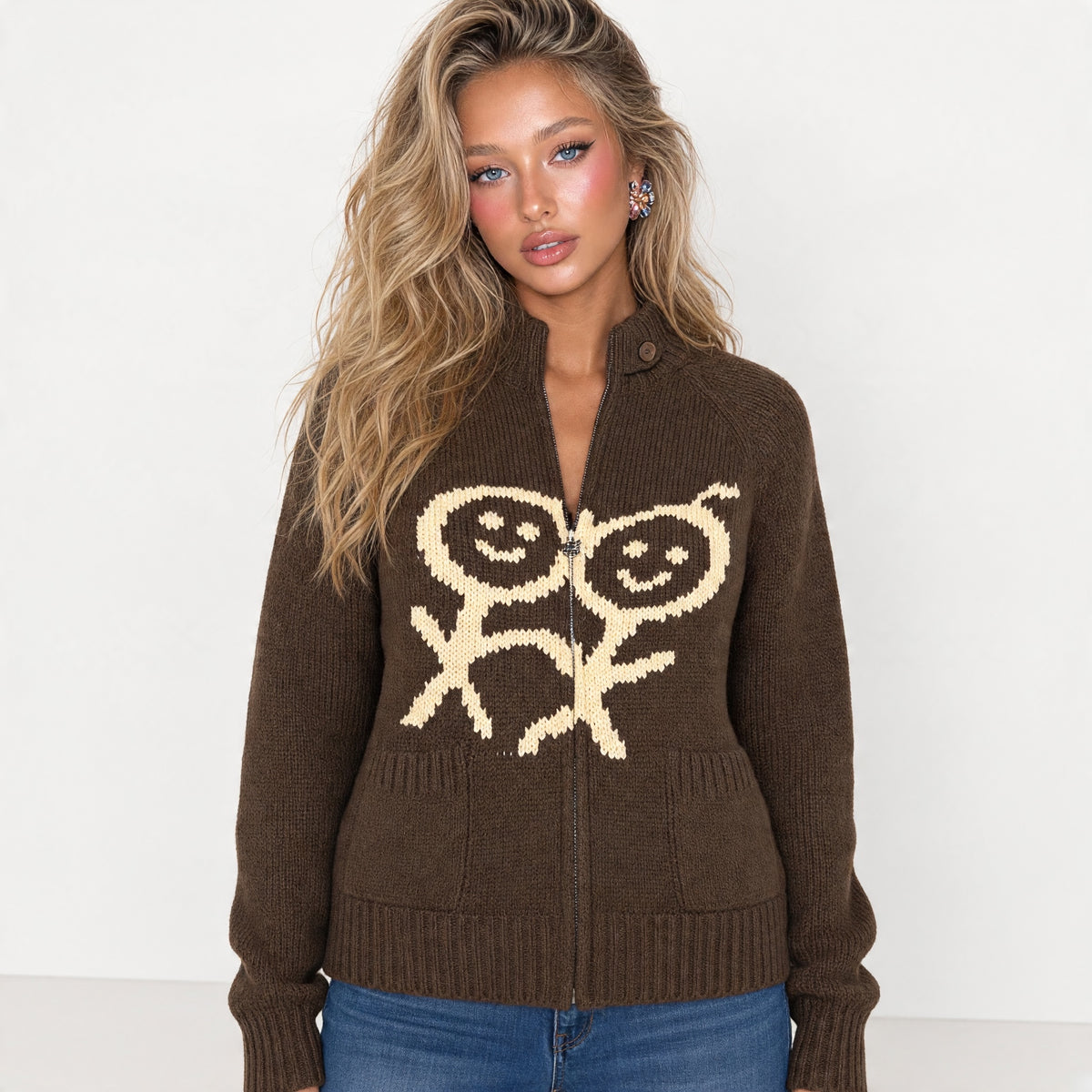 brown chunky knit zip cardigan with cream smiling motif and button tab collar