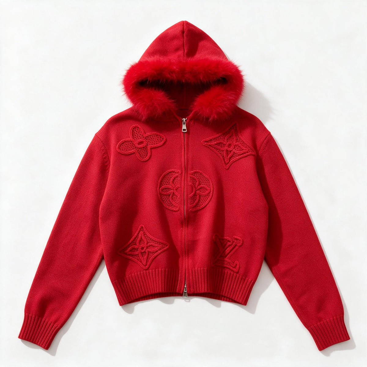Red zip-up knit hoodie with fur-trim hood and raised decorative motifs