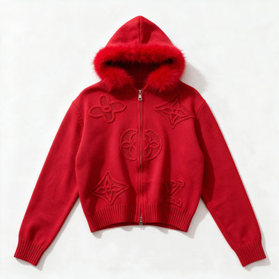 Red zip-up knit hoodie with fur-trim hood and raised decorative motifs