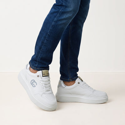 White Gucci platform low-top sneakers with silver heel tab and double-G logo
