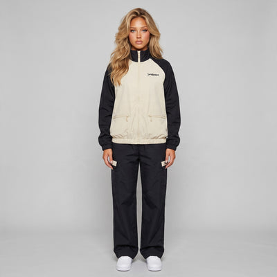 Saint Laurent beige and navy track jacket with cargo trousers laid flat and on model