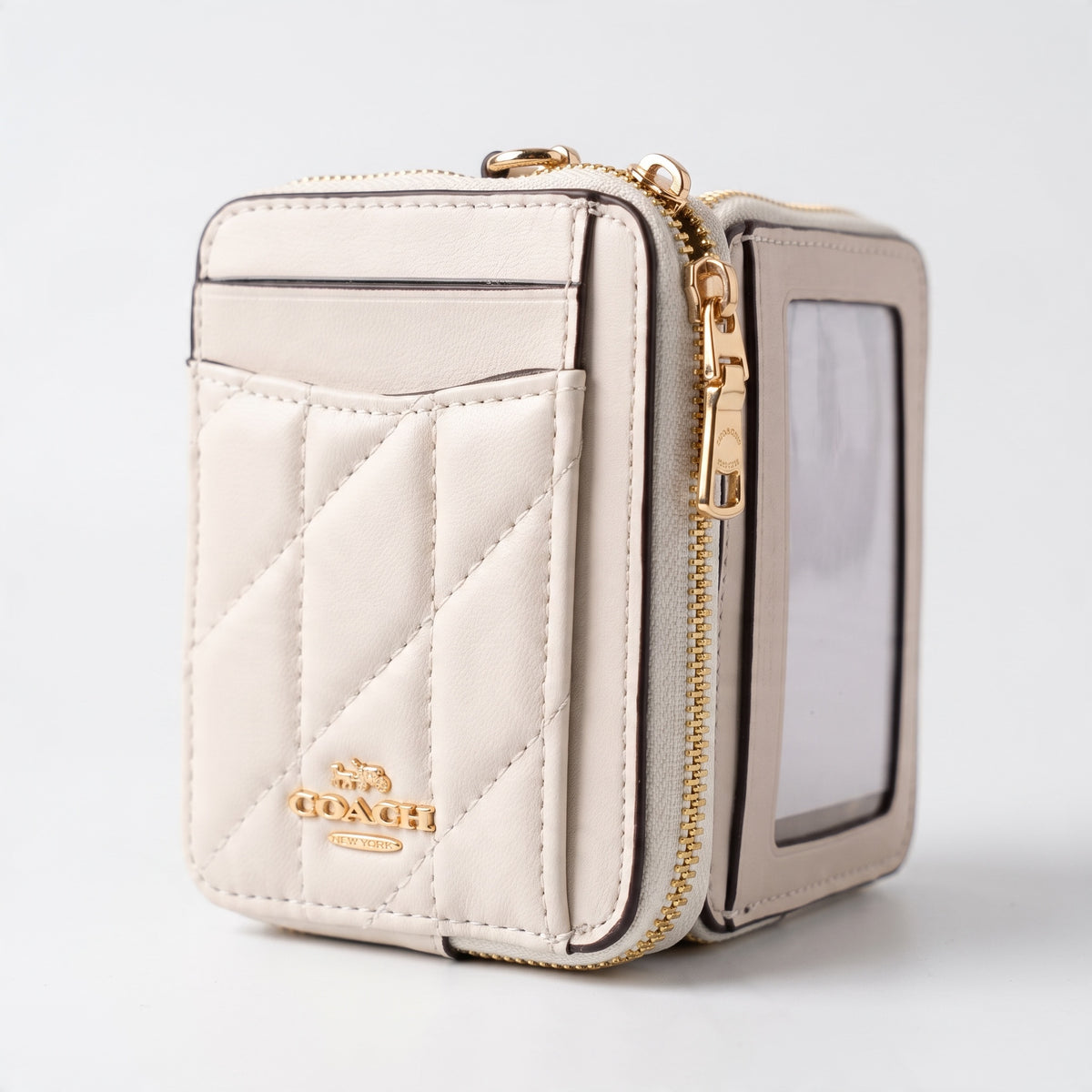 Coach cream quilted zip wallet with clear ID window and gold hardware