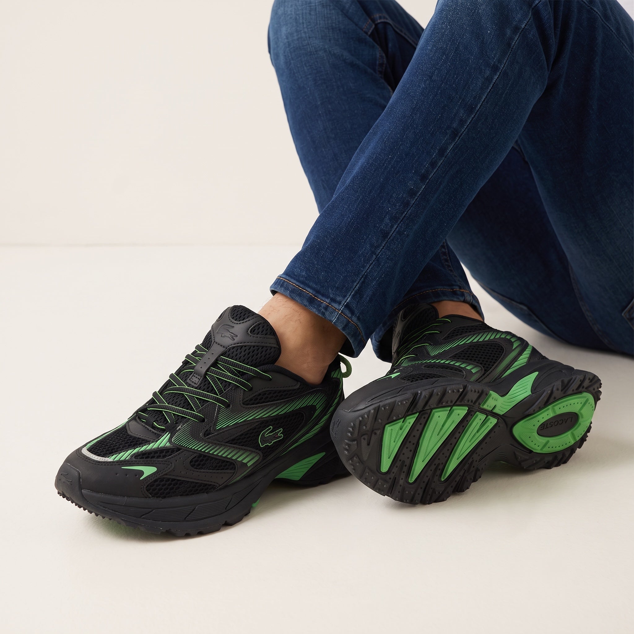 Lacoste black and green chunky low-top sneakers with mesh panels and sculpted sole