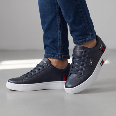 navy Tommy Hilfiger low-top sneakers with white platform sole and logo accents