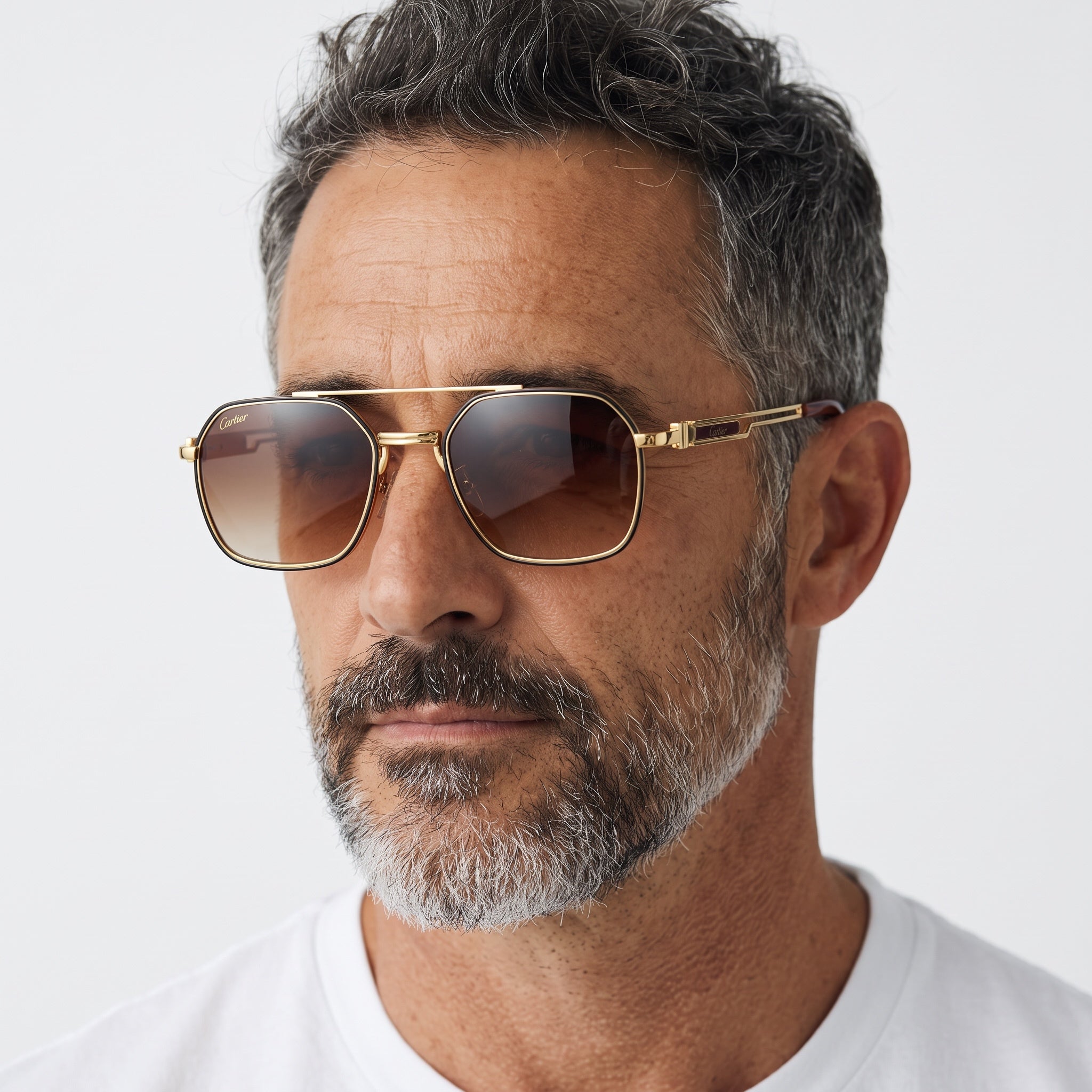 Cartier gold frame sunglasses with brown gradient lenses on model