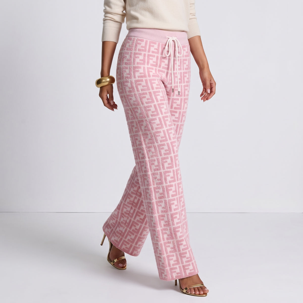 Pink Fendi knit trousers with all-over FF pattern and drawstring waist