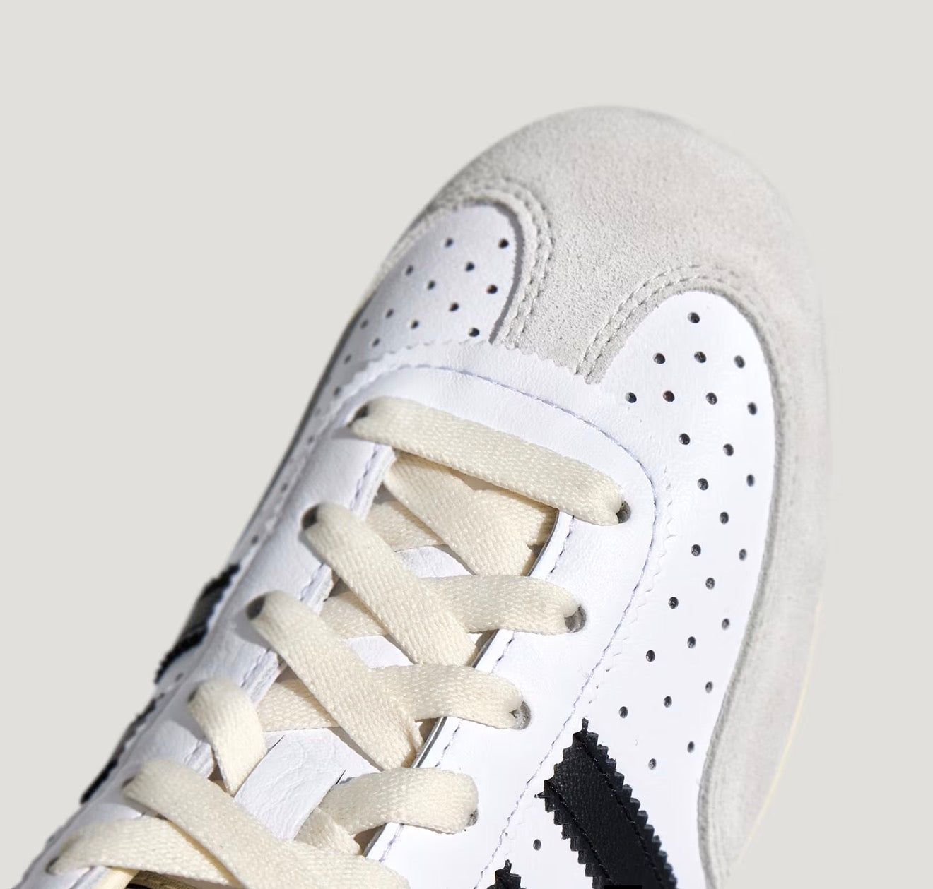 Adidas Chang Le white trainer with black stripes and pale grey suede toe