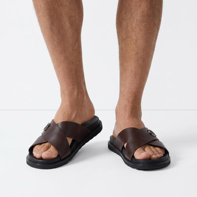 Dior men's brown cross-strap slides with CD logo and black sole