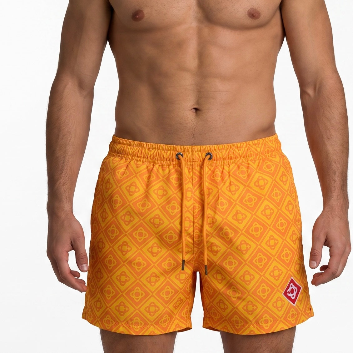 Men's orange monogram swim shorts with elastic waist and drawstring