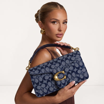 Indigo Coach shoulder bag with large gold C clasp and detachable strap