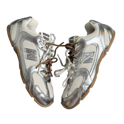 New Balance 328 silver and white trainer with gum sole and mesh upper
