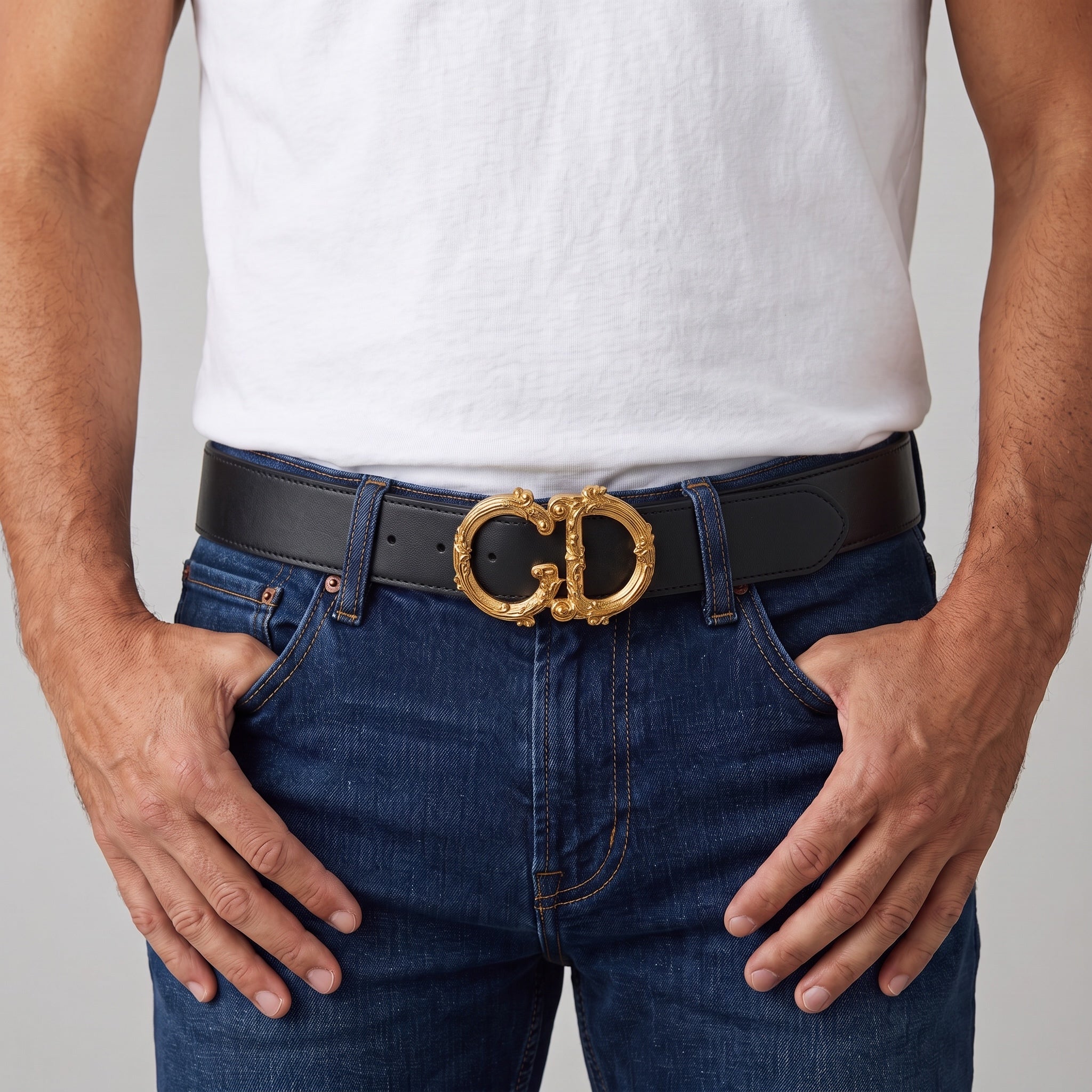 Black belt with ornate gold DG buckle worn with jeans and white tee.
