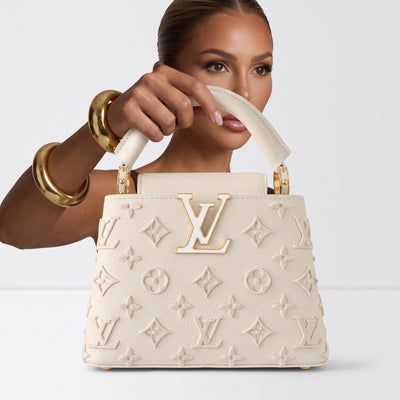 Cream Louis Vuitton top-handle bag with LV logo and monogram appliqué