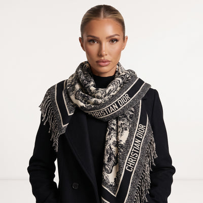 Black and ivory Christian Dior shawl with logo band and fringed edges