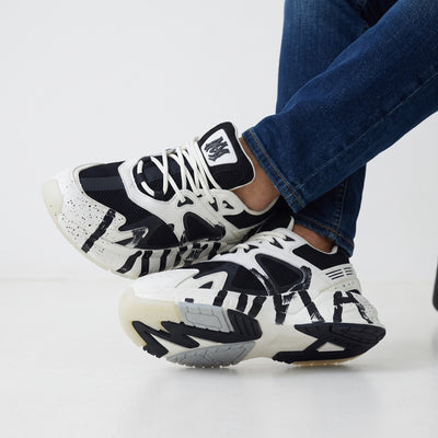Amiri black and white chunky sneakers with paint‑stroke graphics
