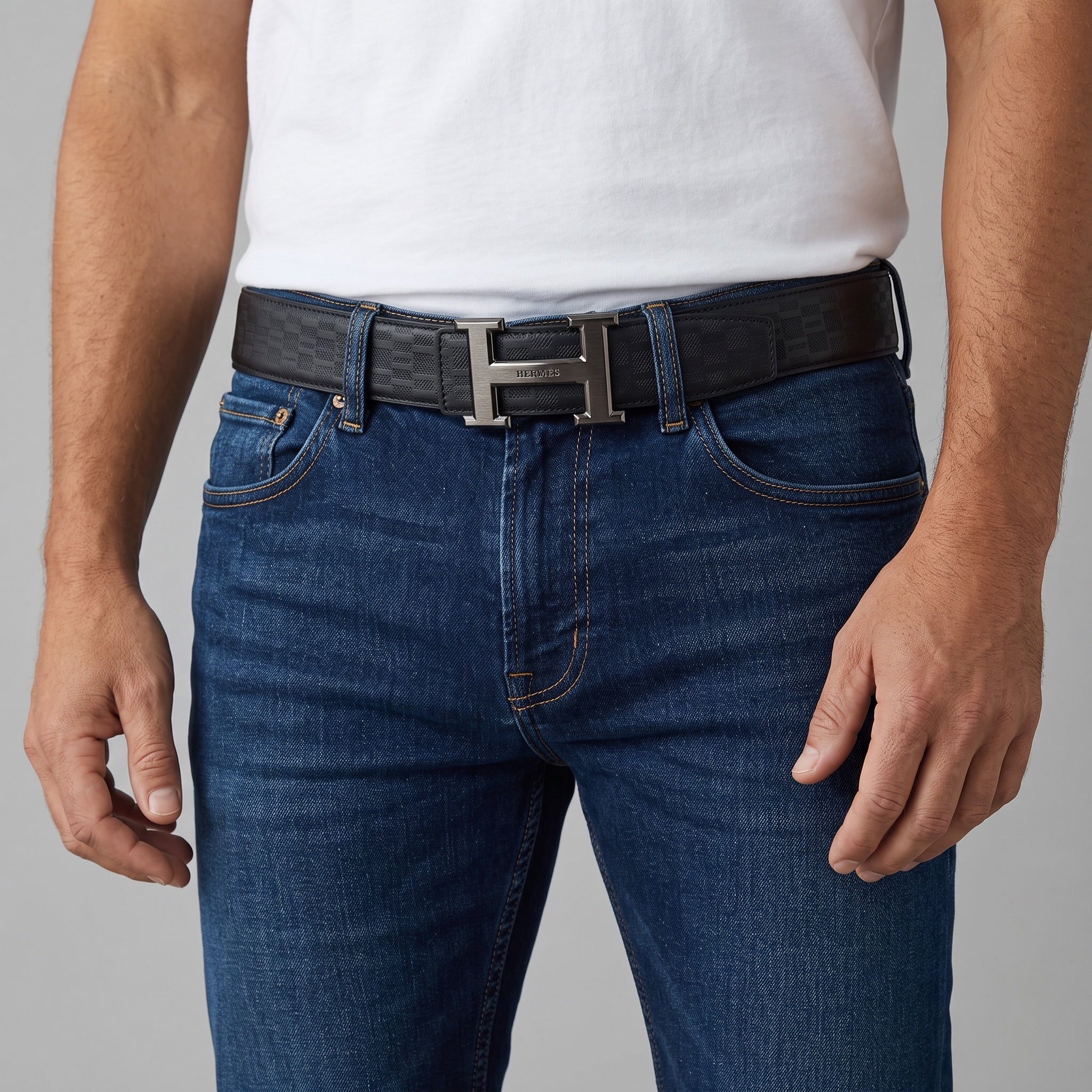 Hermès black belt with H buckle worn with jeans